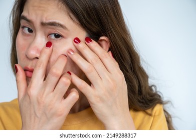 Portrait Of Asian Woman Worried About Her Wrinkled On Her Face. Wrinkles Are Creases, Folds, Or Ridges In The Skin. They Naturally Appear As People Get Older.