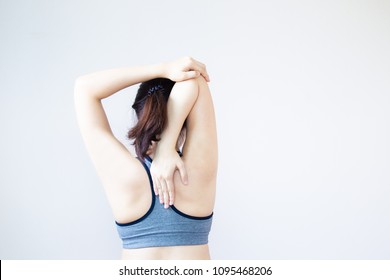 Portrait of Asian women age between 25-30 years old doing a stretching before exercise close up haft body. - Powered by Shutterstock