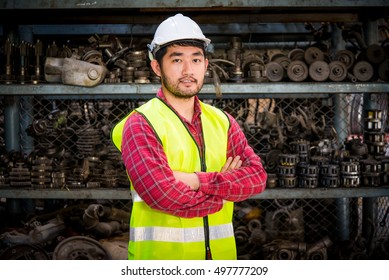  Portrait Of Asian Worker In Factory Warehouse Car Parts.