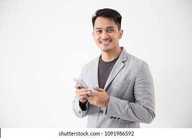 portrait of Asian Young Business man with smart cell phone