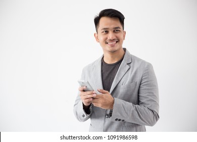 portrait of Asian Young Business man with smart cell phone