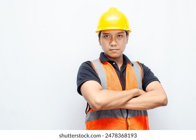 Portrait of an Asian young confident construction worker or engineer standing and looking up to show a bright future over a white background. bright future business and worker concept. - Powered by Shutterstock