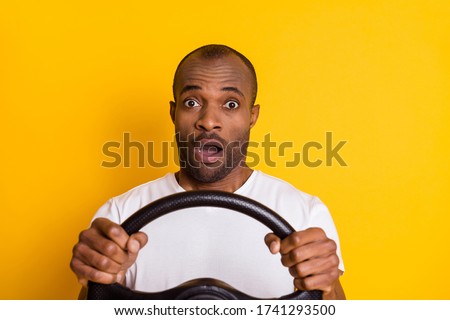 Portrait of astonished afro american driver hold steering wheel impressed big city traffic jam scream omg wear style stylish trendy clothes isolated over shine color background