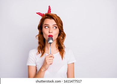 Portrait Of Astonished Girl Lick Spoon Hold Hand Look Copyspace Impressed With Yummy Supper Wear Stylish T-shirt Isolated Over White Color Background