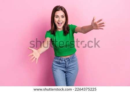 Portrait of astonished positive girl toothy smile raise opened arms welcome you isolated on pink color background