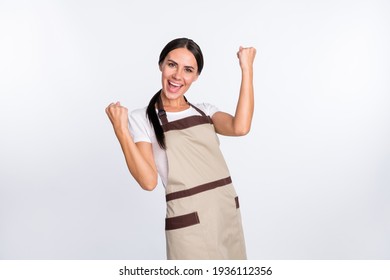 Portrait of astonished positive lady fists up open mouth shout yeah celebrate isolated on white color background