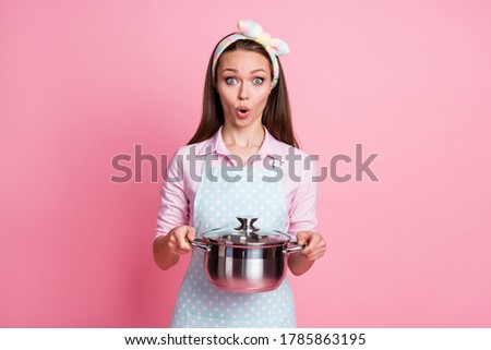 Portrait of astonished wife girl hold saucepan impressed yummy gourmet soup wear dotted shirt isolated over pastel color background