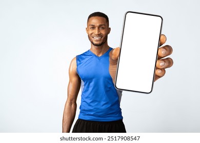 Portrait Of Athletic Black Man Holding Bottle Of Refreshing Water, Resting After Workout, Thirsty Male With A Drink - Powered by Shutterstock