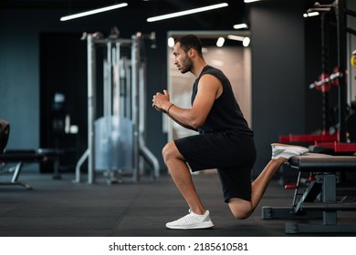 Portrait Of Athletic Black Man Making Bulgarian Split Squat Exercise At Gym, Motivated Young African American Male Training On Leg Muscles At Modern Sport Club, Enjoying Bodybuilding, Side View