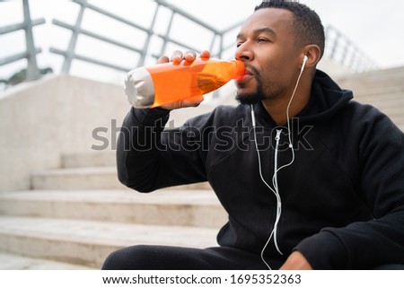 Similar – Image, Stock Photo Man hydrating after workout in Poblenou, Barcelona