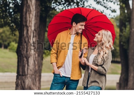 Portrait of attractive adorable amorous cheerful couple life partners meeting romance strolling using parasol outdoors
