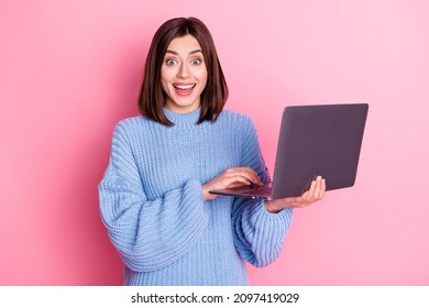Portrait of attractive amazed cheerful girl agent broker using laptop having fun isolated over pink pastel color background - Shutterstock ID 2097419029