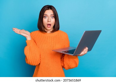 Portrait Of Attractive Amazed Clueless Girl Using Laptop New Web Offer Isolated Over Bright Blue Color Background