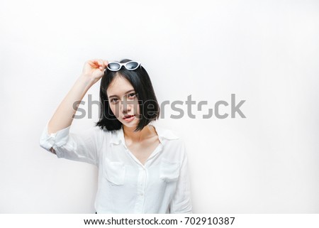 portrait of attractive asian hipster girl isolated on white background