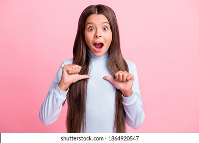 Portrait of attractive astonished cheerful girl pointing at herself pick me isolated over pink pastel color background