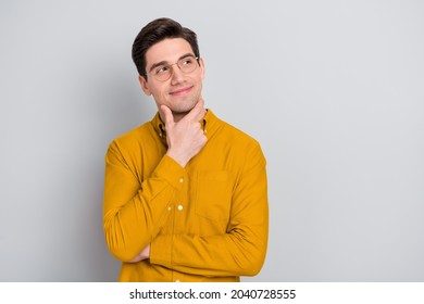 Portrait Of Attractive Bewildered Cheerful Man Manager Thinking Copy Space Isolated Over Grey Color Background