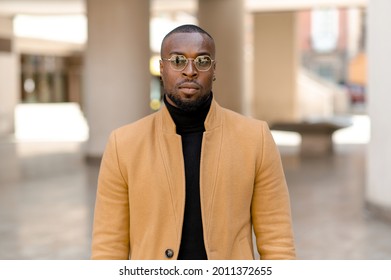 Portrait Of Attractive Black Man With Serious Face Looking At The Camera. Bearded Guy With Sunglasses In Stylish Elegant Clothing