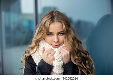 Portrait of an attractive blonde in the street