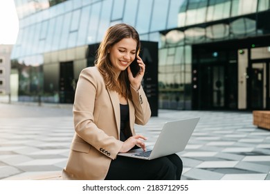 Portrait Of Attractive Business Lady Calling On The Phone When Sitting Outdoors