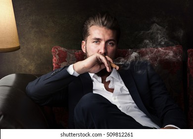 Portrait Of An Attractive Business Man With A Cigar 