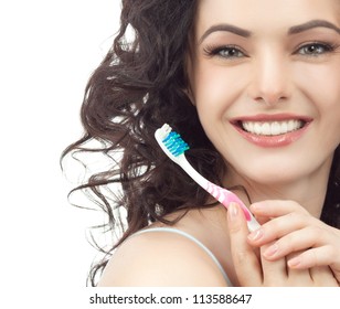 Portrait Of Attractive  Caucasian Smiling Woman Brunette Isolated On White Studio Shot Head And Shoulders Face Skin Hand Hair Looking At Camera With Tooth Brush