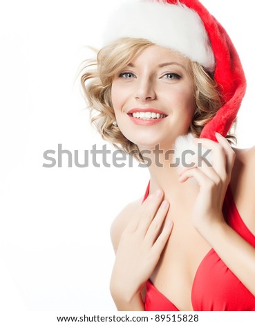 portrait of attractive  caucasian smiling woman blond isolated on white studio shot in santa's hat and red dress