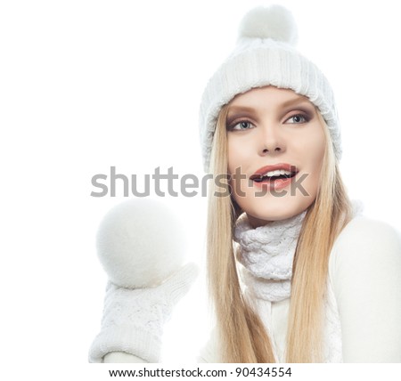 portrait of attractive  caucasian woman  with long blond hair in warm clothing isolated on white studio shot with snowball