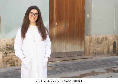 Portrait Of Attractive Caucasian Young Woman Model Smiling With Eyeglasses. Pharmacist, Therapist, Scientist, Veterinarian, Beautician, Healthcare, Optometrist, In The City, Dark Air. Place For Your T