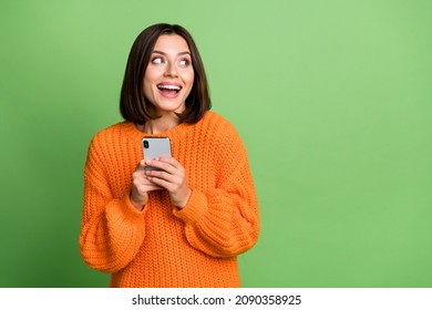 Portrait of attractive cheerful amazed girl blogger using gadget smm copy space isolated over bright green color background - Shutterstock ID 2090358925