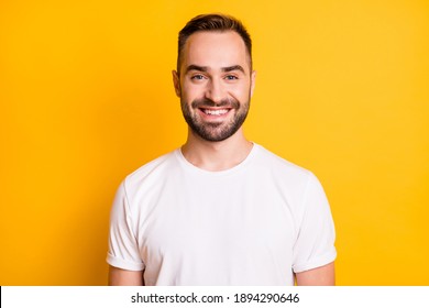 Portrait of attractive cheerful bearded guy freelancer wearing white tshirt isolated over bright yellow color background - Shutterstock ID 1894290646