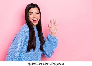 Portrait Of Attractive Cheerful Brown-haired Girl Waving Hello Copy Space Isolated Over Pink Pastel Color Background