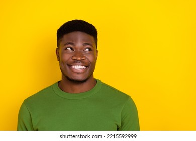 Portrait of attractive cheerful brunet guy making decision copy blank space isolated on bright yellow color background