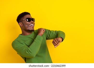 Portrait of attractive cheerful careful guy dancing having fun amusement copy space event isolated over bright yellow color background - Powered by Shutterstock