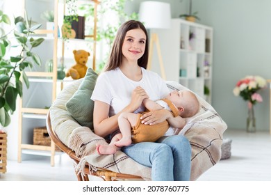 Portrait Of Attractive Cheerful Careful Sweet Girl Holding Nursing Baby Day Dream Sleep Nap Time At Light Home Flat Indoors