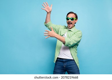 Portrait Of Attractive Cheerful Childish Foolish Man Dancing Having Fun Free Time Isolated Over Bright Blue Color Background