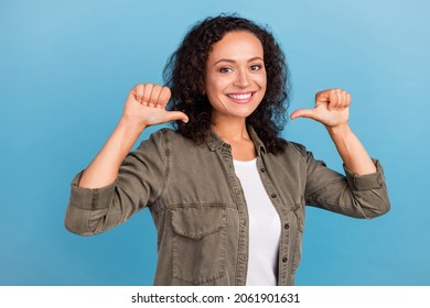 Portrait of attractive cheerful cool successful girl demonstrating herself isolated over bright blue color background