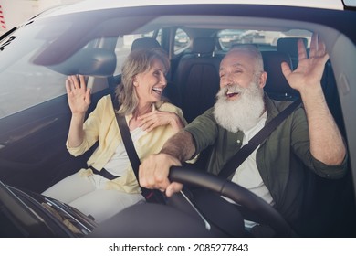 Portrait of attractive cheerful couple riding car having fun singing song spending vacation holiday day good mood - Powered by Shutterstock