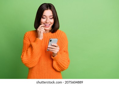 Portrait of attractive cheerful curious girl using gadget smm post media copy space isolated over bright green color background - Shutterstock ID 2075604889