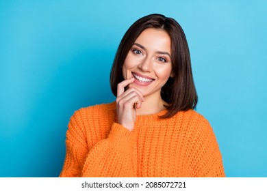 Portrait of attractive cheerful funny curious girl touching lip deciding isolated over vivid blue color background - Powered by Shutterstock