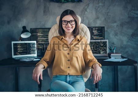 Portrait of attractive cheerful girl ceo boss chief qualified executive director sitting in chair at workplace workstation indoors