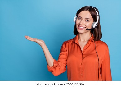Portrait of attractive cheerful girl help desk service specialist holding copy space isolated over bright blue color background - Shutterstock ID 2144111067