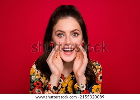 Portrait of attractive cheerful girly brunet girl saying good news info share isolated over bright red color background