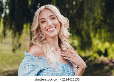 Portrait of attractive cheerful impressed wavy-haired girl enjoying good weather having fun outside outdoors - Shutterstock ID 2124425135