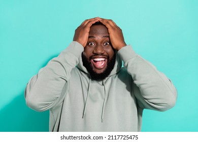 Portrait Of Attractive Cheerful Overwhelmed Guy News Reaction Win Lottery Isolated Over Bright Teal Turquoise Color Background