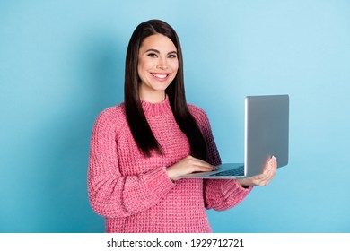Portrait of attractive cheerful person hands hold laptop beaming smile look camera isolated on blue color background