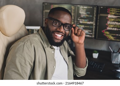 Portrait Of Attractive Cheerful Smart Clever Guy Editing Data Developing Web Project Touching Specs At Workplace Workstation Indoors