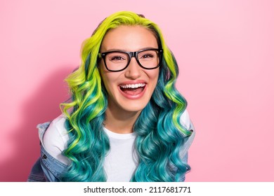 Portrait of attractive cheerful wavy-haired girl laughing hilarious joke good mood isolated over pink pastel color background