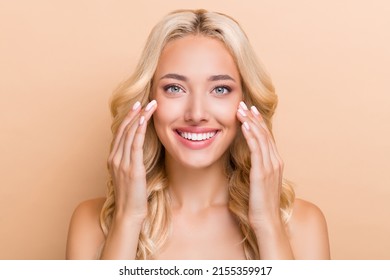 Portrait Of Attractive Cheerful Wavy-haired Girl Washing Clear Pure Skin Uplift Effect Isolated Over Beige Pastel Color Background