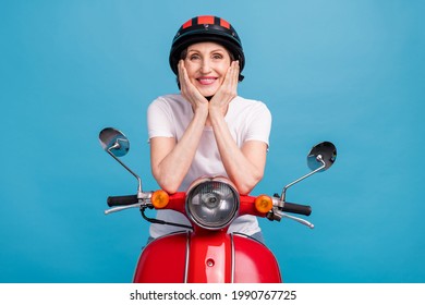 Portrait Of Attractive Cheerful Woman Sitting Riding Motor Bike Free Time Isolated Over Bright Blue Color Background