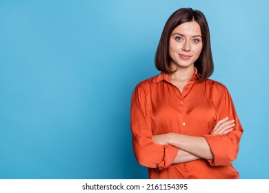 Portrait of attractive cheery content skilled girl agent broker folded arms copy blank space isolated over bright blue color background - Powered by Shutterstock